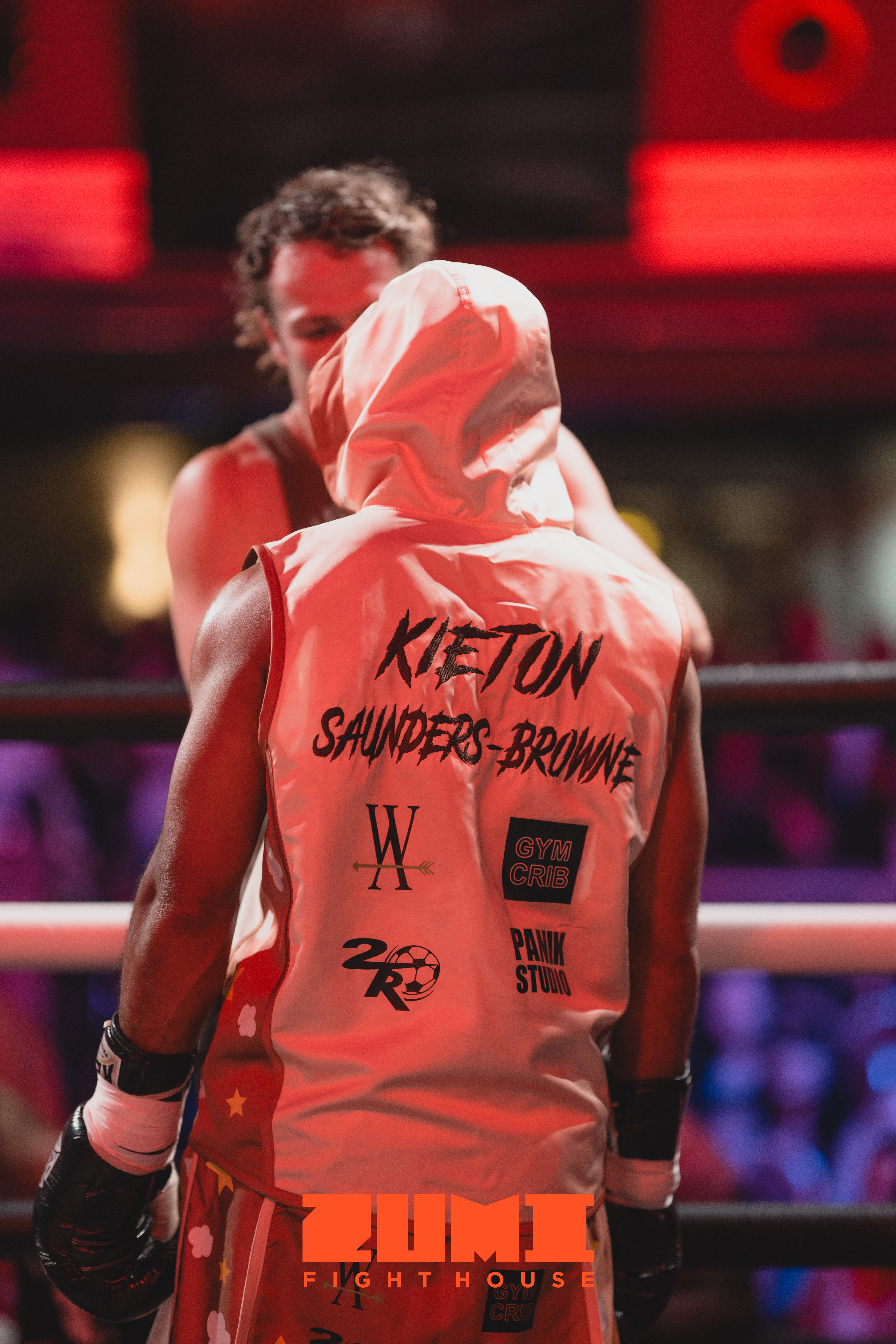 Zumi Fight House fighter in ringwalk hoodie inside the ring